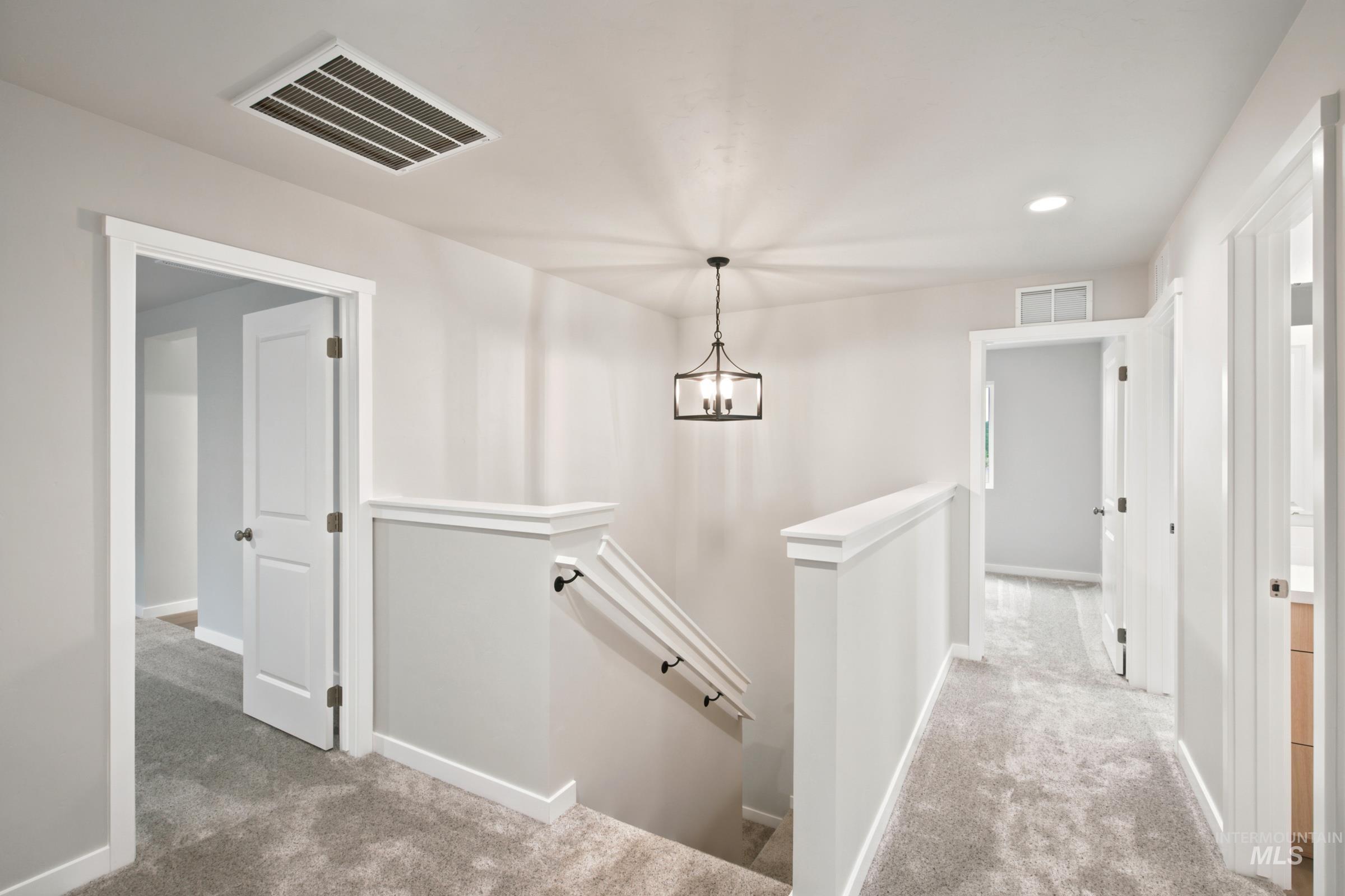 472 Merlin Court Middleton, ID 83644 - Photo 22 of 25 Neutral wall tones, recessed lighting fixture, and window with white trim