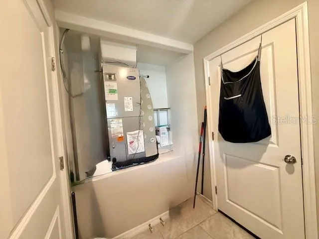 a living room with a couch and a window