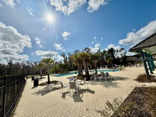 a view of a park with swings and slides