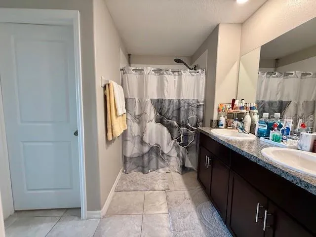 a kitchen with a sink and a refrigerator