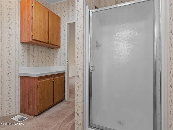 a kitchen with stainless steel appliances granite countertop cabinets and a refrigerator