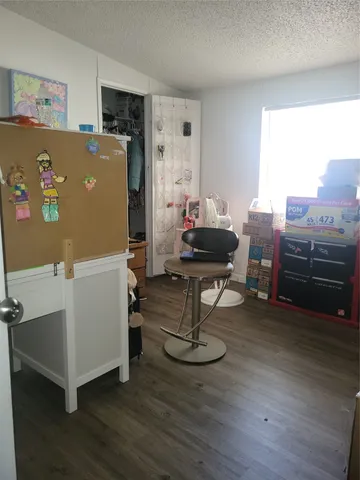 a bedroom with a bed and a mirror