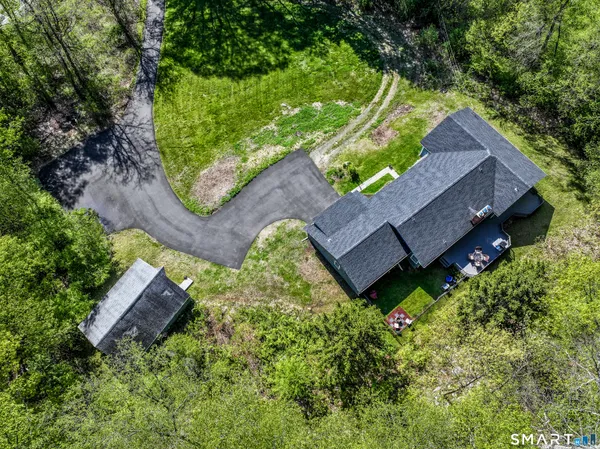 an aerial view of house with yard