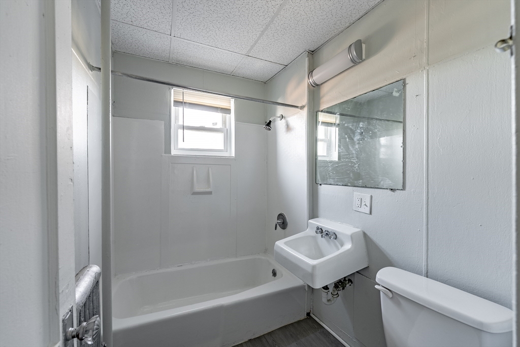 202-212 Pearl Street Springfield, MA 01105 - Photo 20 of 42 a bathroom with a sink toilet and shower