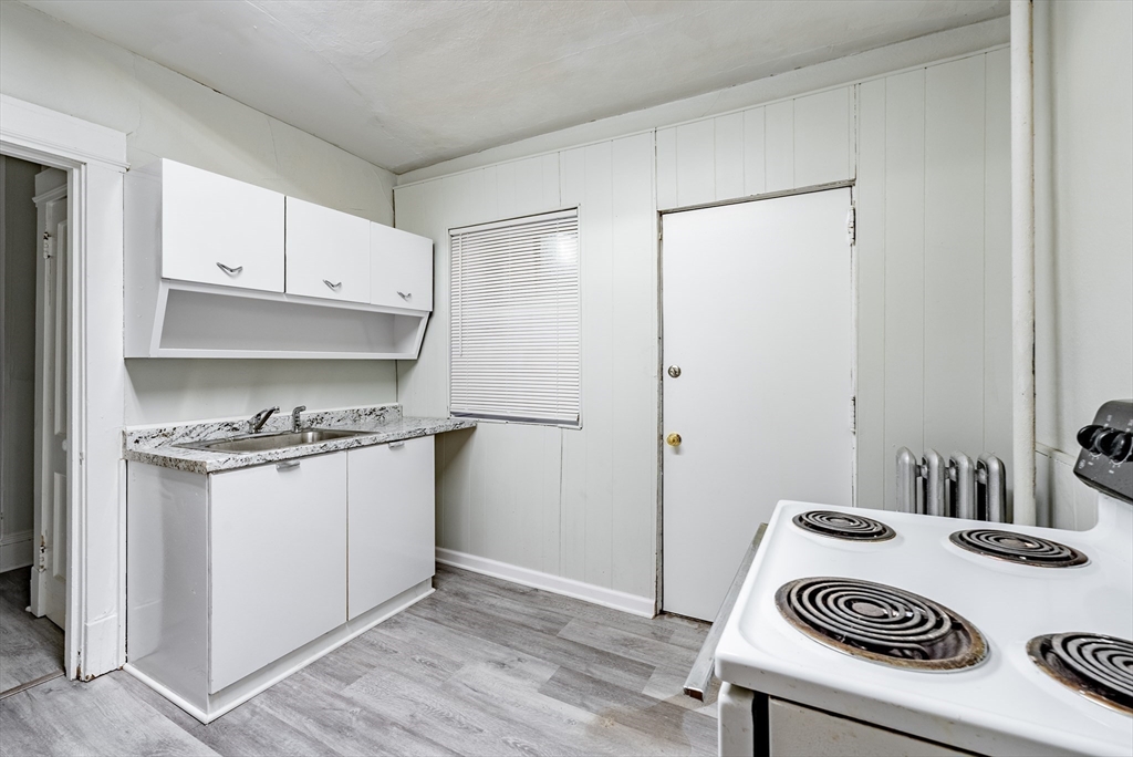 202-212 Pearl Street Springfield, MA 01105 - Photo 23 of 42 a kitchen with a stove and a refrigerator