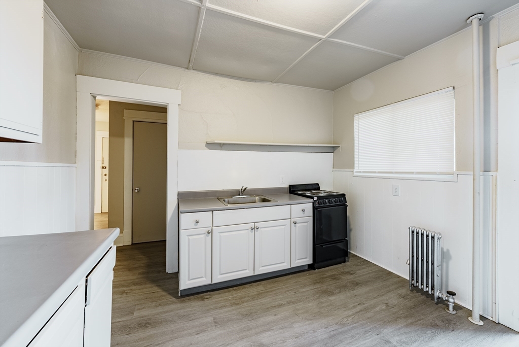 202-212 Pearl Street Springfield, MA 01105 - Photo 25 of 42 a kitchen with stainless steel appliances granite countertop a stove and a refrigerator