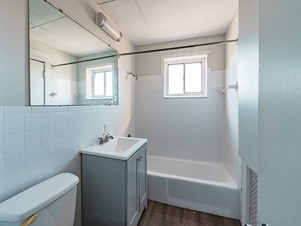 202-212 Pearl Street Springfield, MA 01105 - Photo 5 of 42 a bathroom with a sink toilet and bathtub
