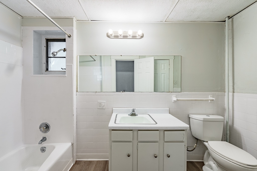 202-212 Pearl Street Springfield, MA 01105 - Photo 7 of 42 a bathroom with a sink a toilet and shower