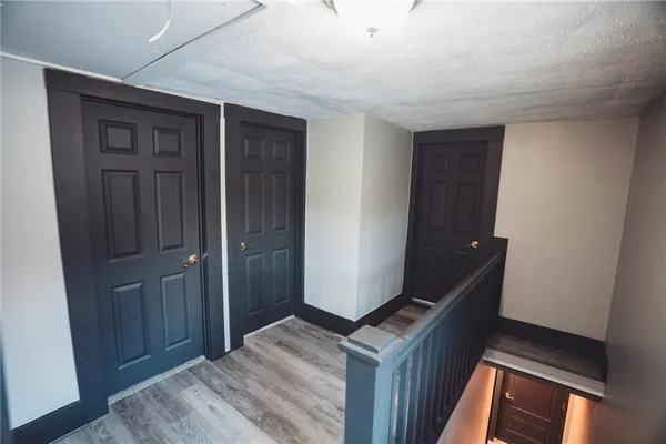 a view of empty room with wooden walls