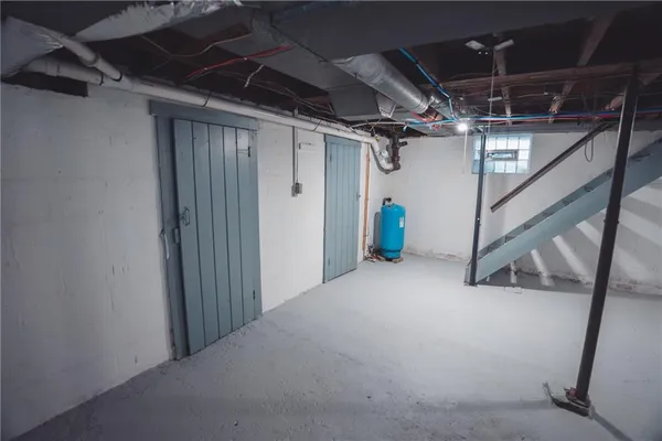 a view of empty room with wooden walls