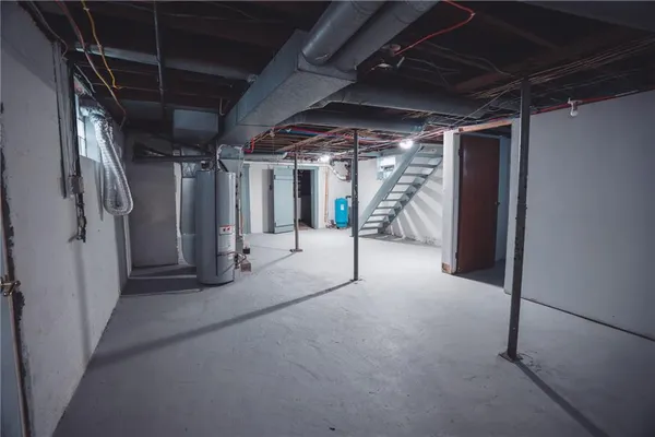 a view of empty room with wooden walls