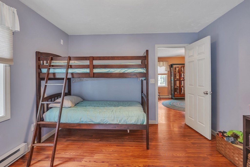 44 Buffum Road Charlton, MA 01507 - Photo 19 of 37 a bedroom with a bunk bed and wooden floor
