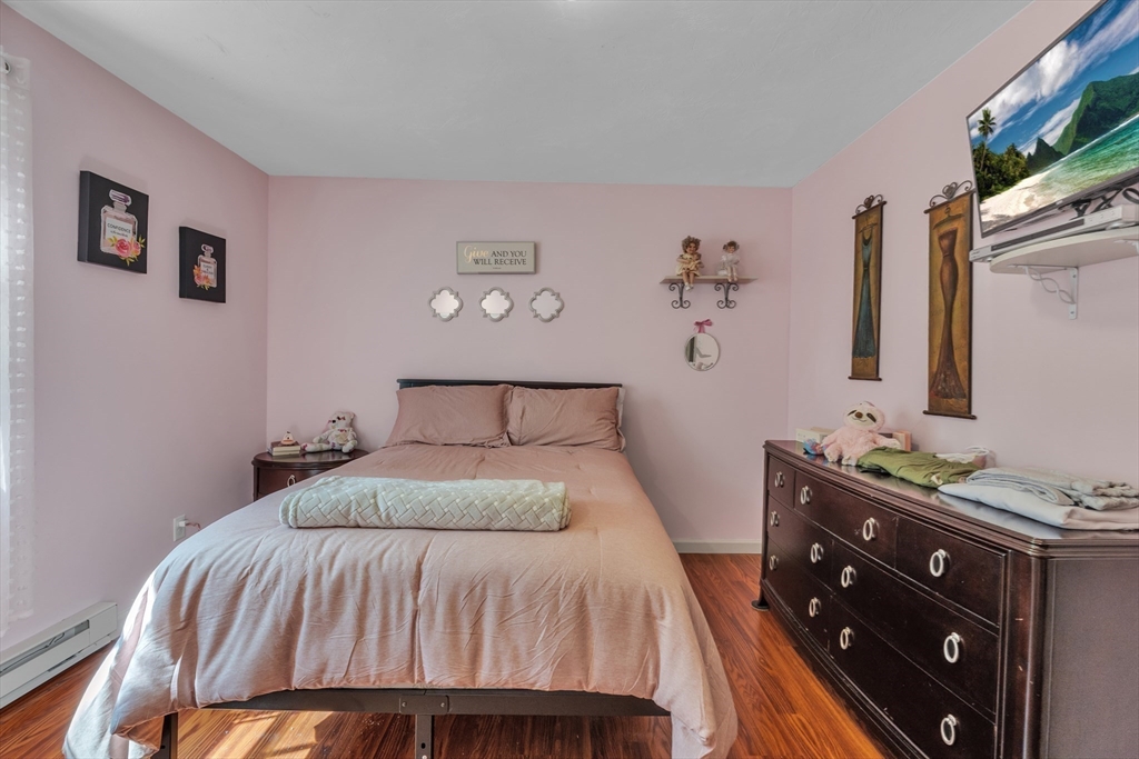 44 Buffum Road Charlton, MA 01507 - Photo 20 of 37 a bedroom with a bed and a mirror