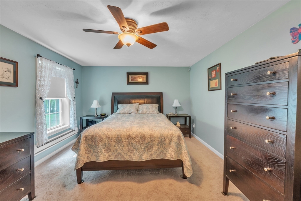 44 Buffum Road Charlton, MA 01507 - Photo 27 of 37 a bedroom with a bed and a large window