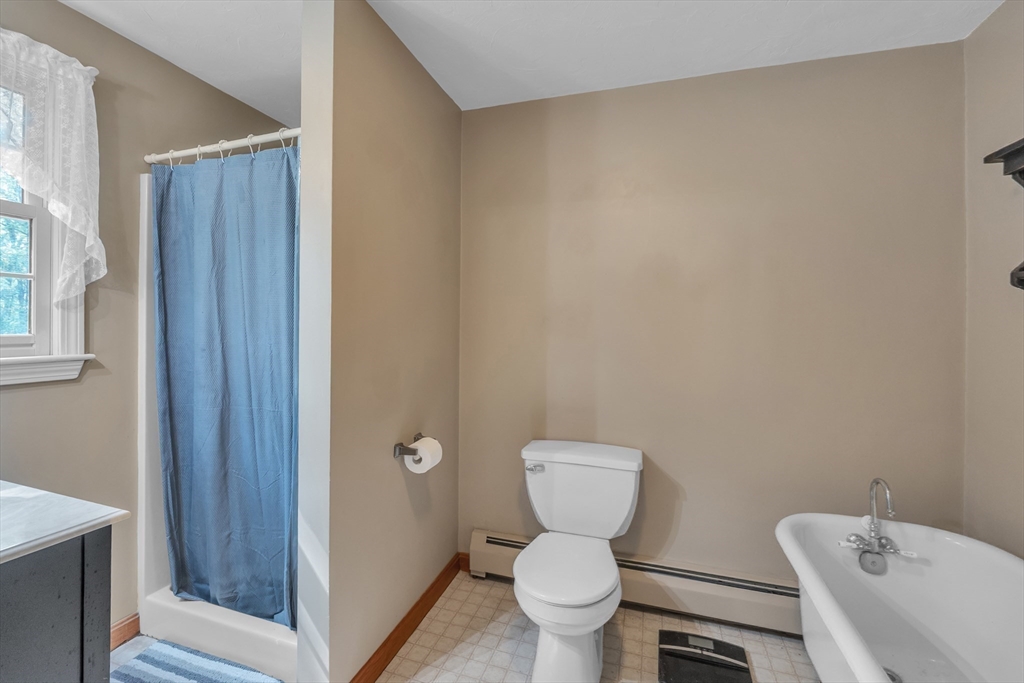 44 Buffum Road Charlton, MA 01507 - Photo 29 of 37 a a bathroom with a toilet a sink and a shower