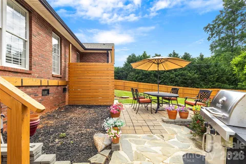 a view of a chairs and table in backyard