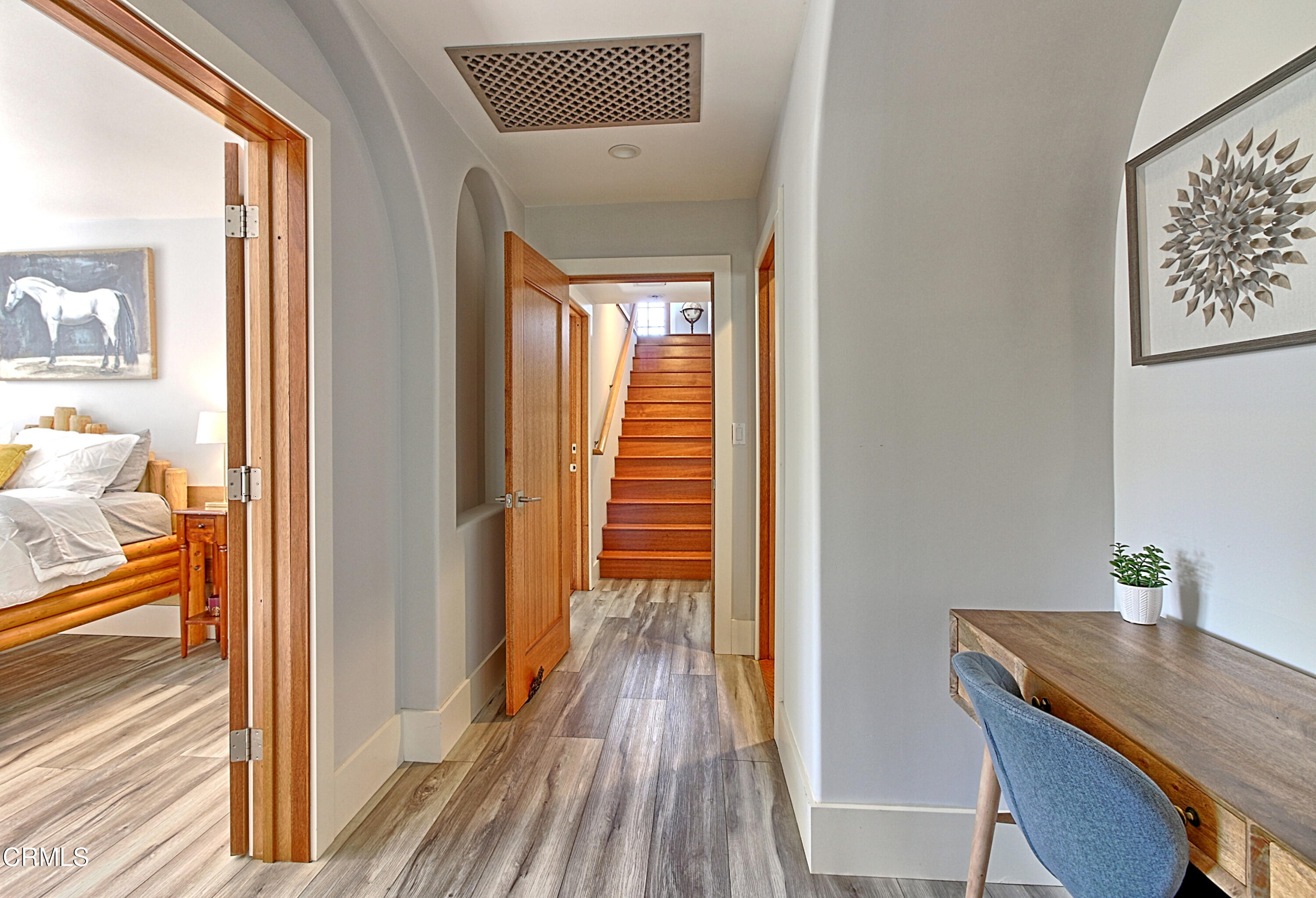 1159 Spring Street Oak View, CA 93022 - Photo 7 of 38 a view of a hallway view with wooden floor and furniture