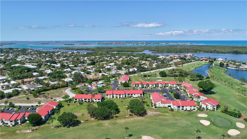 5433 Southeast Miles Grant Road, Unit E203 Stuart, FL 34997 - Photo 35 of 42 a view of a city with lots of buildings