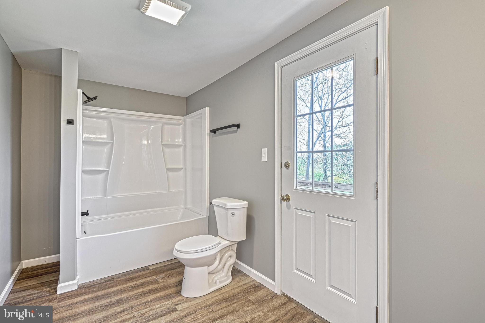 35 Herrs Ridge Road Gettysburg, PA 17325 - Photo 26 of 66 a bathroom with a toilet shower and a window