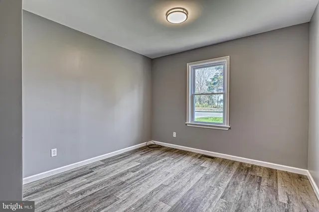 a bathroom with a sink a mirror and a toilet
