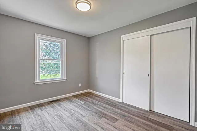 a view of an empty room with a fireplace