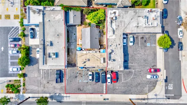 an aerial view of houses with outdoor space