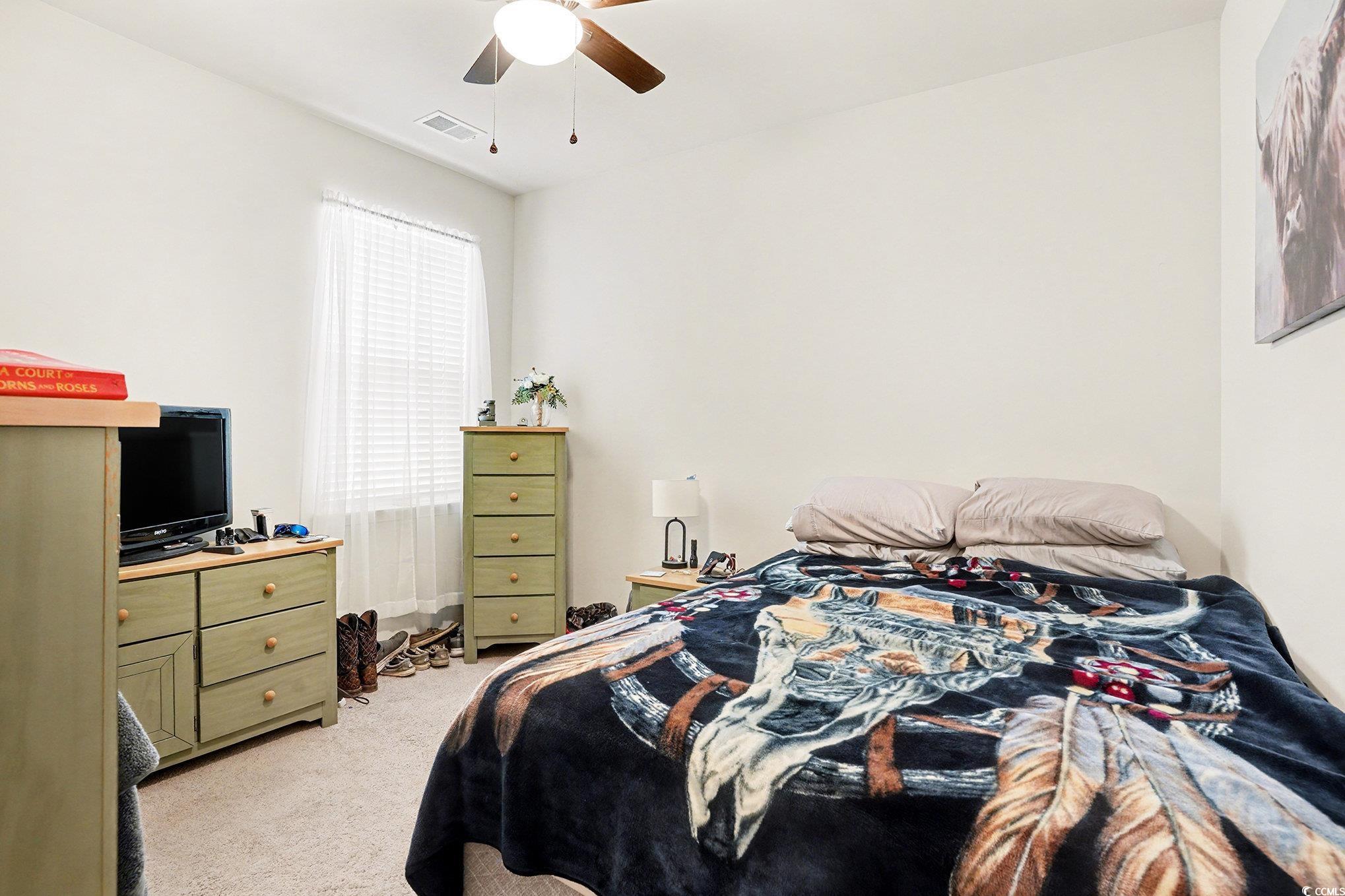 3923 Nandina Court Conway, SC 29526 - Photo 20 of 28 Bedroom featuring light carpet and a ceiling fan
