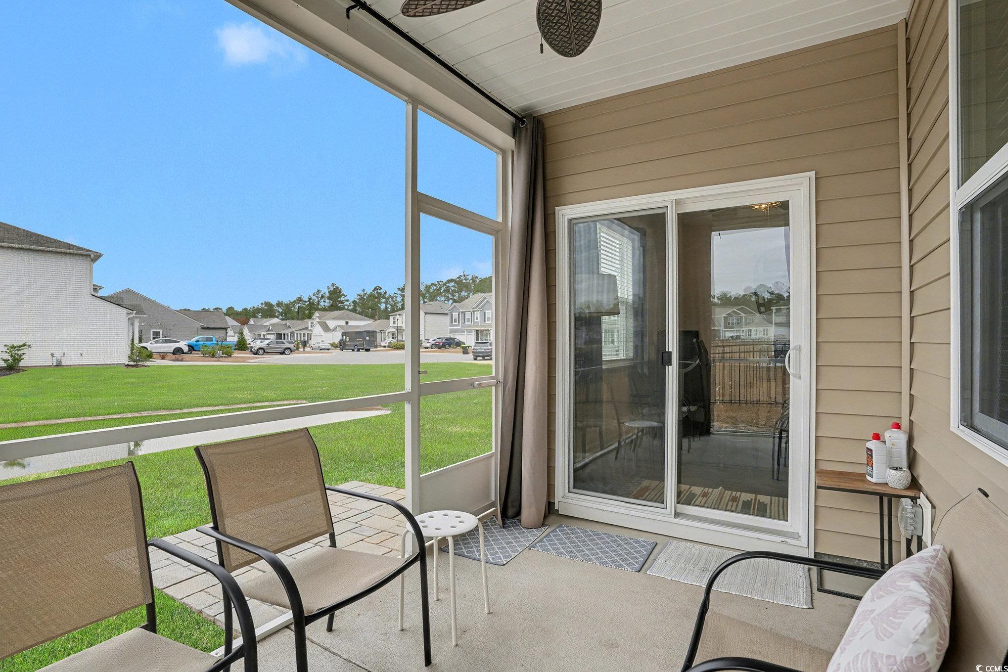 3923 Nandina Court Conway, SC 29526 - Photo 24 of 28 Sunroom / solarium featuring a residential view and a ceiling fan