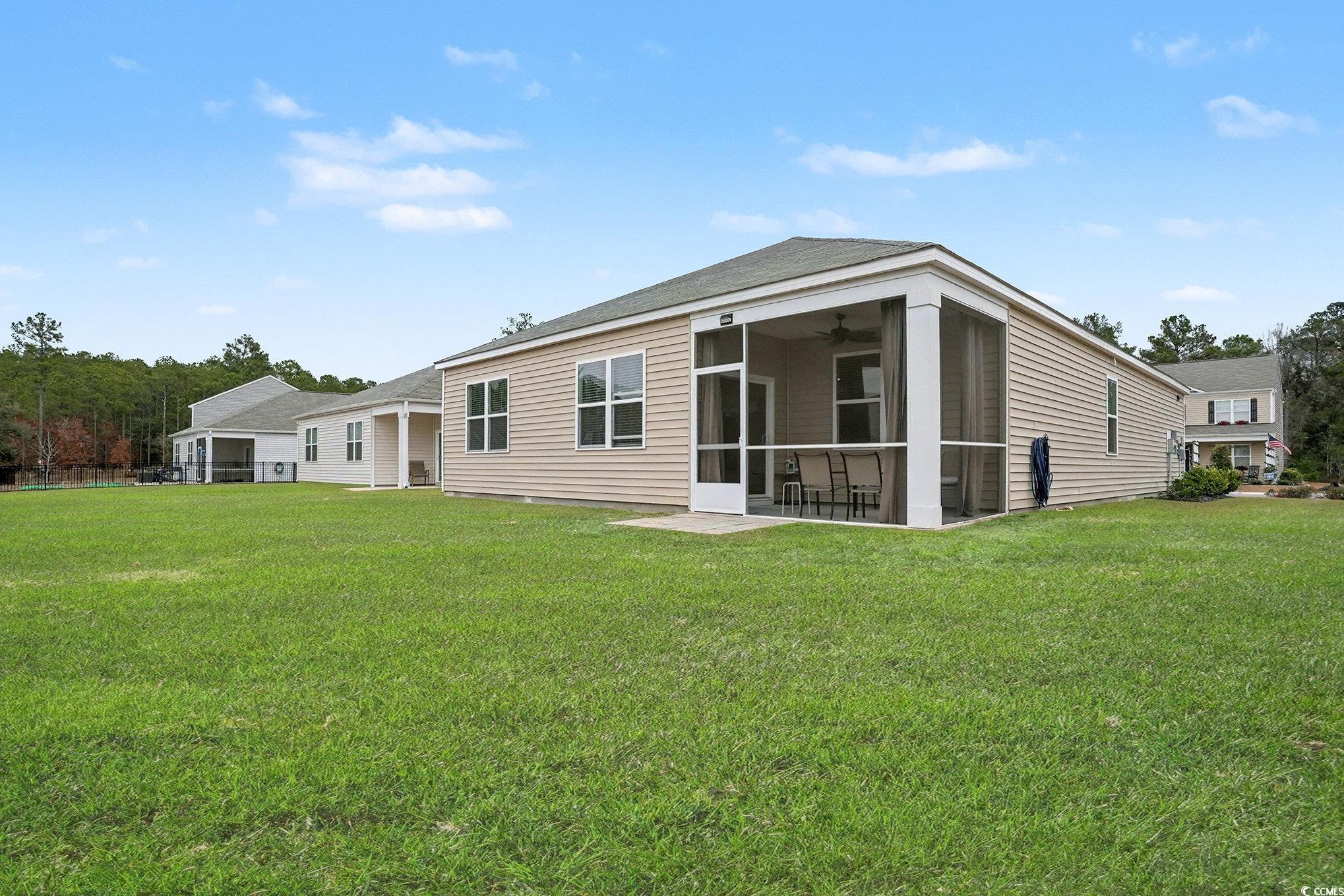3923 Nandina Court Conway, SC 29526 - Photo 26 of 28 Rear view of property with a sunroom, a lawn, and a ceiling fan