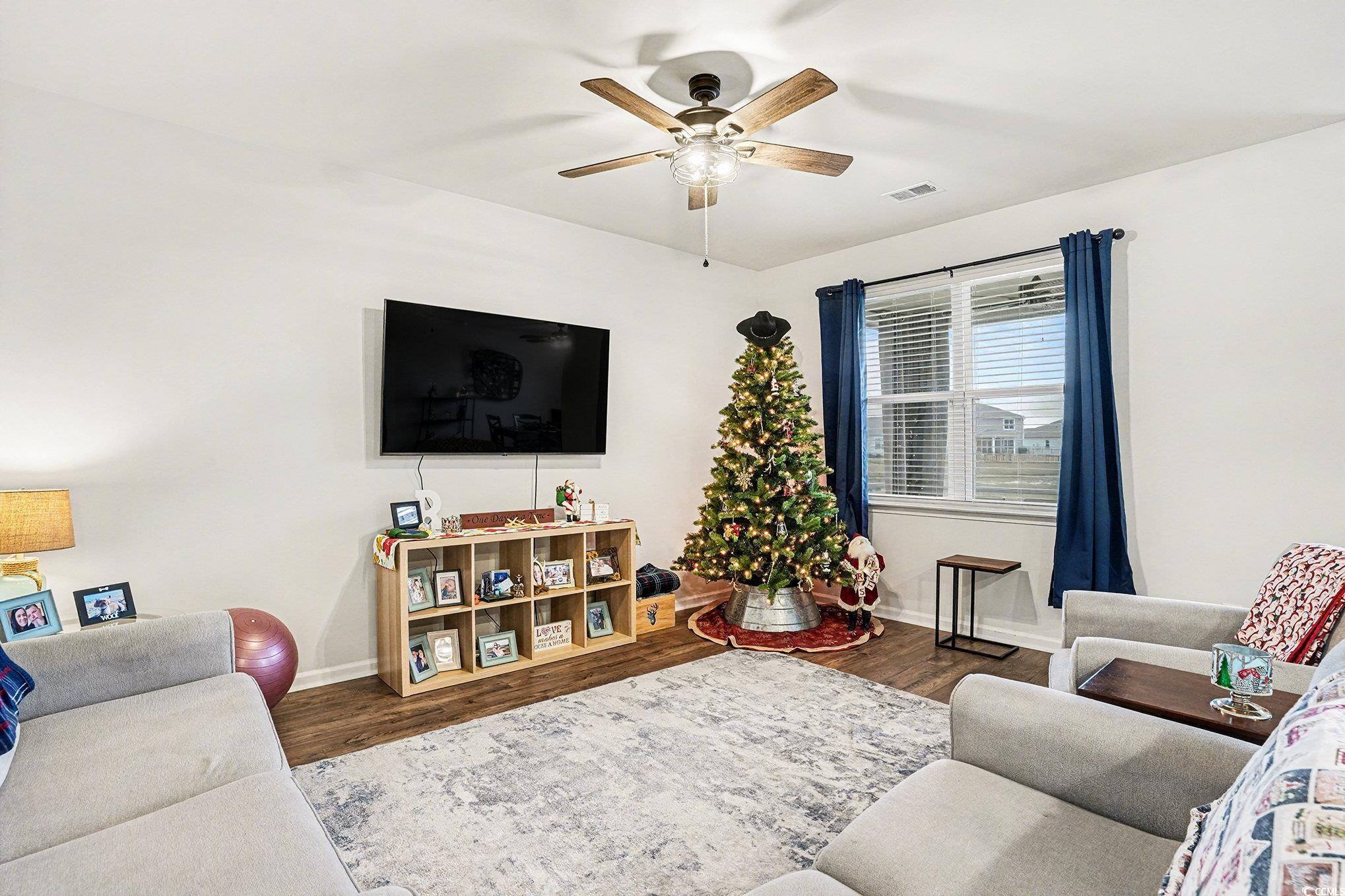 3923 Nandina Court Conway, SC 29526 - Photo 7 of 28 Living area with dark wood finished floors and ceiling fan