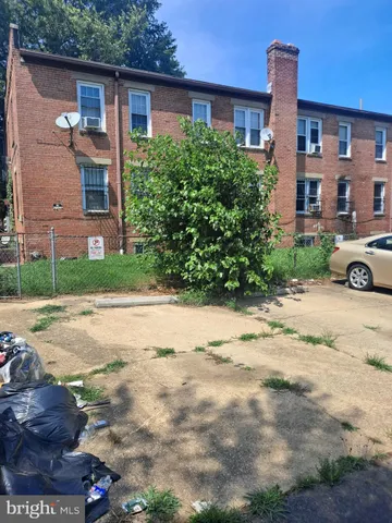 a front view of a house with a yard and a garage