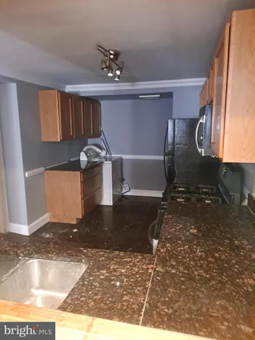 a view of a livingroom with wooden floor