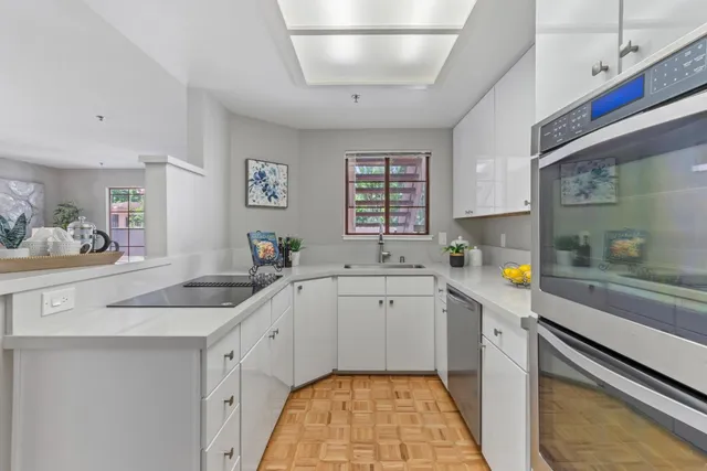 a kitchen with a sink and cabinets
