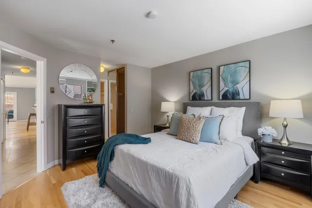 a bedroom with a bed and a dresser