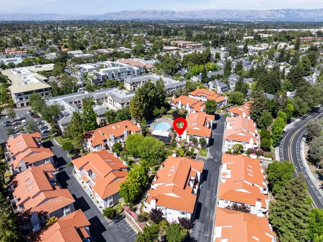 an aerial view of residential houses with outdoor space