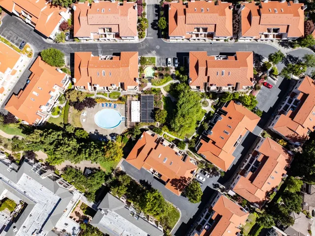 an aerial view of a house with a lake view