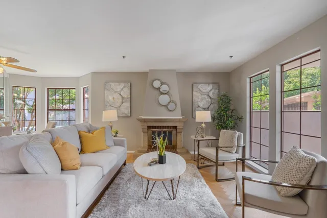 a living room with furniture and a fireplace
