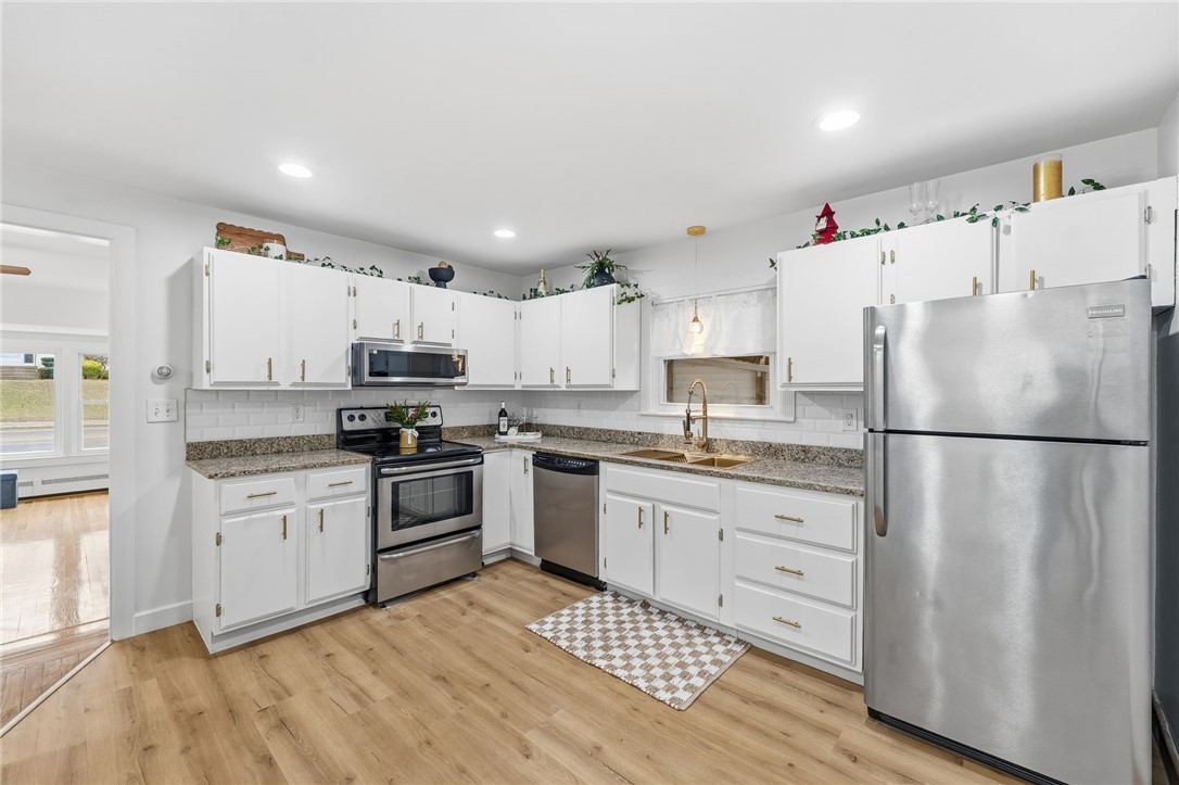 461 River Road Lincoln, RI 02865 - Photo 3 of 30 Eat in Kitchen with new LVP flooring and lighting