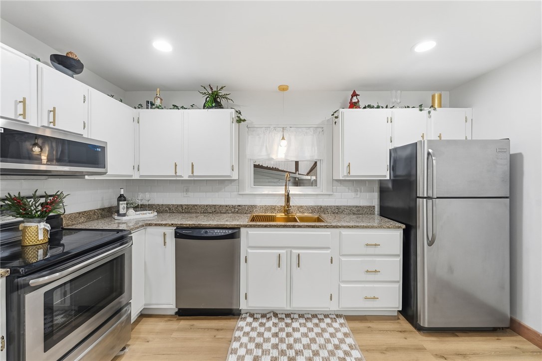 461 River Road Lincoln, RI 02865 - Photo 4 of 30 White cabinets, granite countertops, stainless appliances