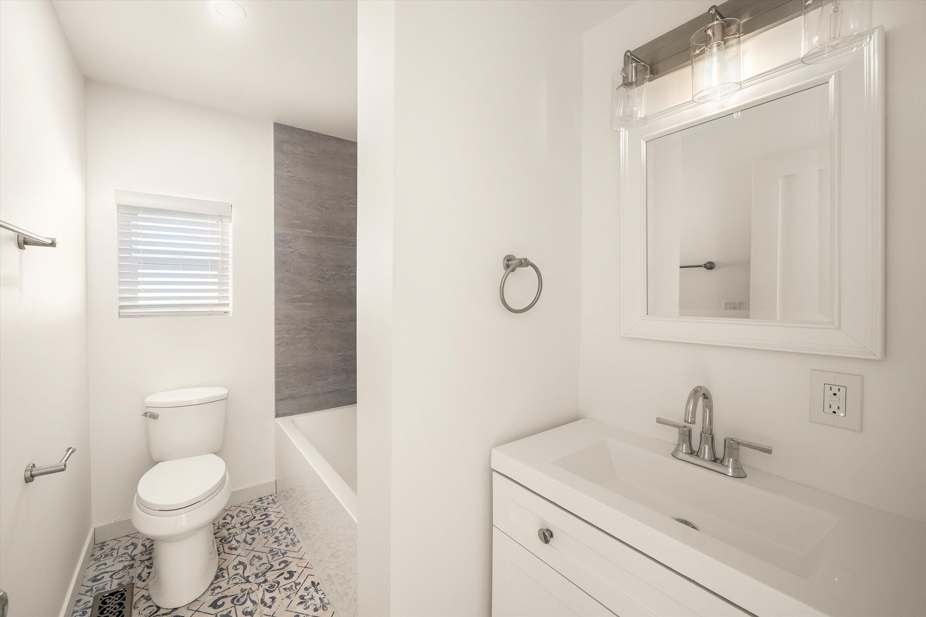 5700 Via Real, Unit 75 Carpinteria, CA 93013 - Photo 12 of 20 a bathroom with a sink a toilet and a mirror