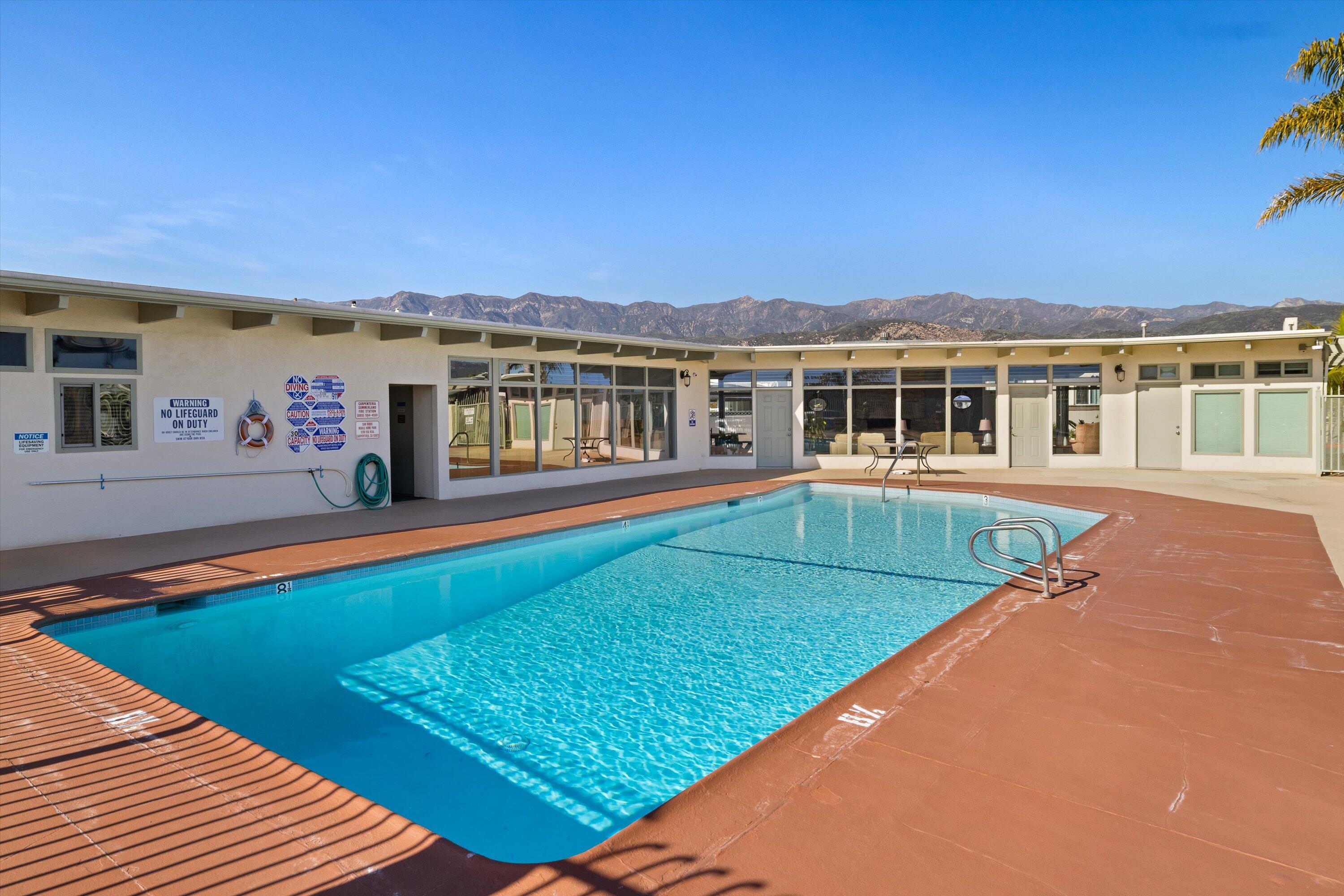 5700 Via Real, Unit 75 Carpinteria, CA 93013 - Photo 17 of 20 a view of a house with pool and a yard