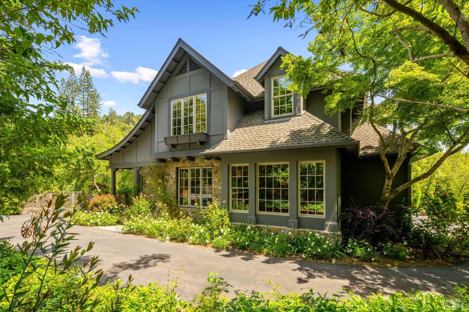 4504 Redwood Road Napa, CA 94558 - Photo 2 of 57 a front view of a house with a garden
