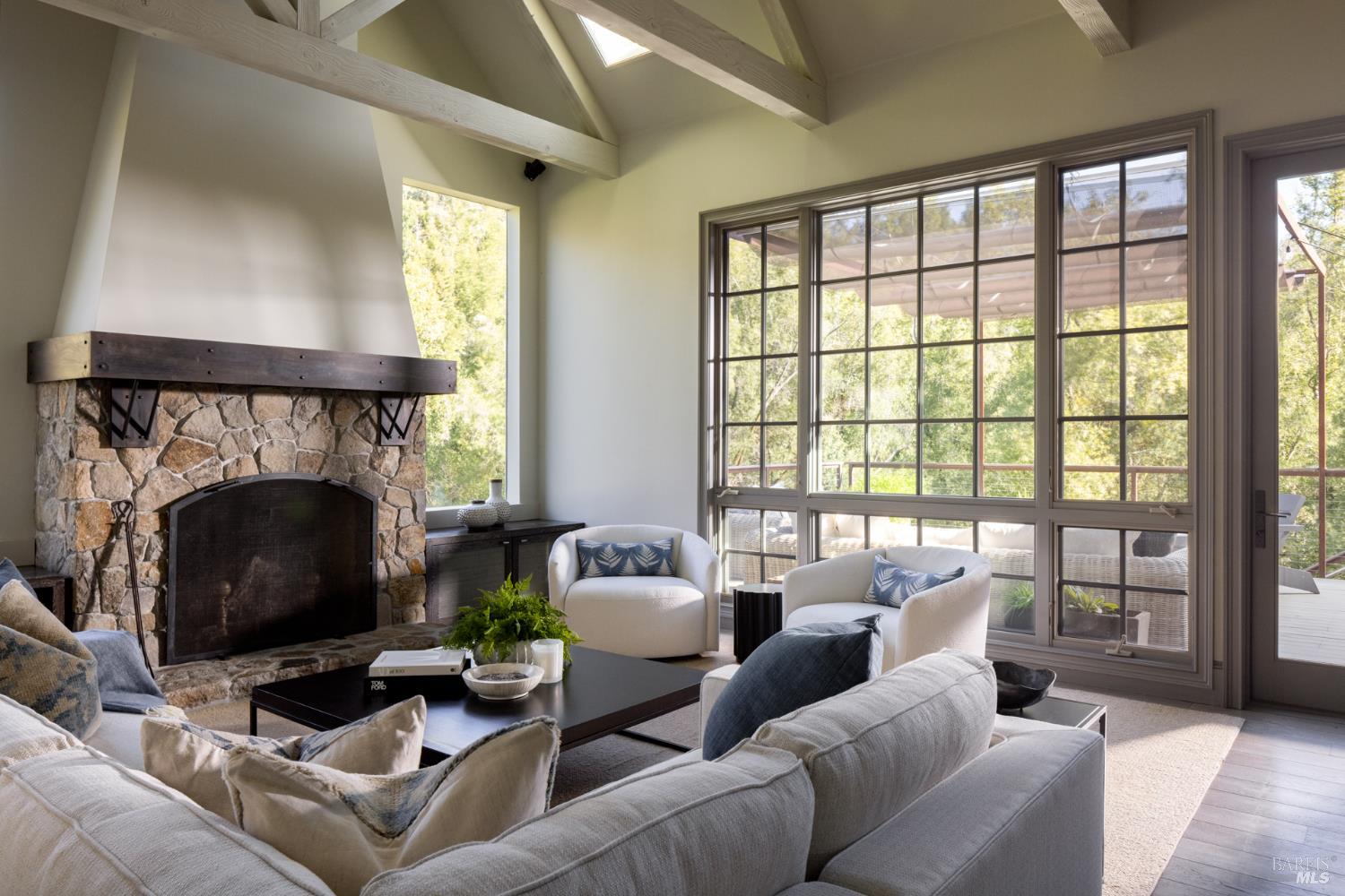 4504 Redwood Road Napa, CA 94558 - Photo 21 of 57 a living room with furniture a large window and a fireplace