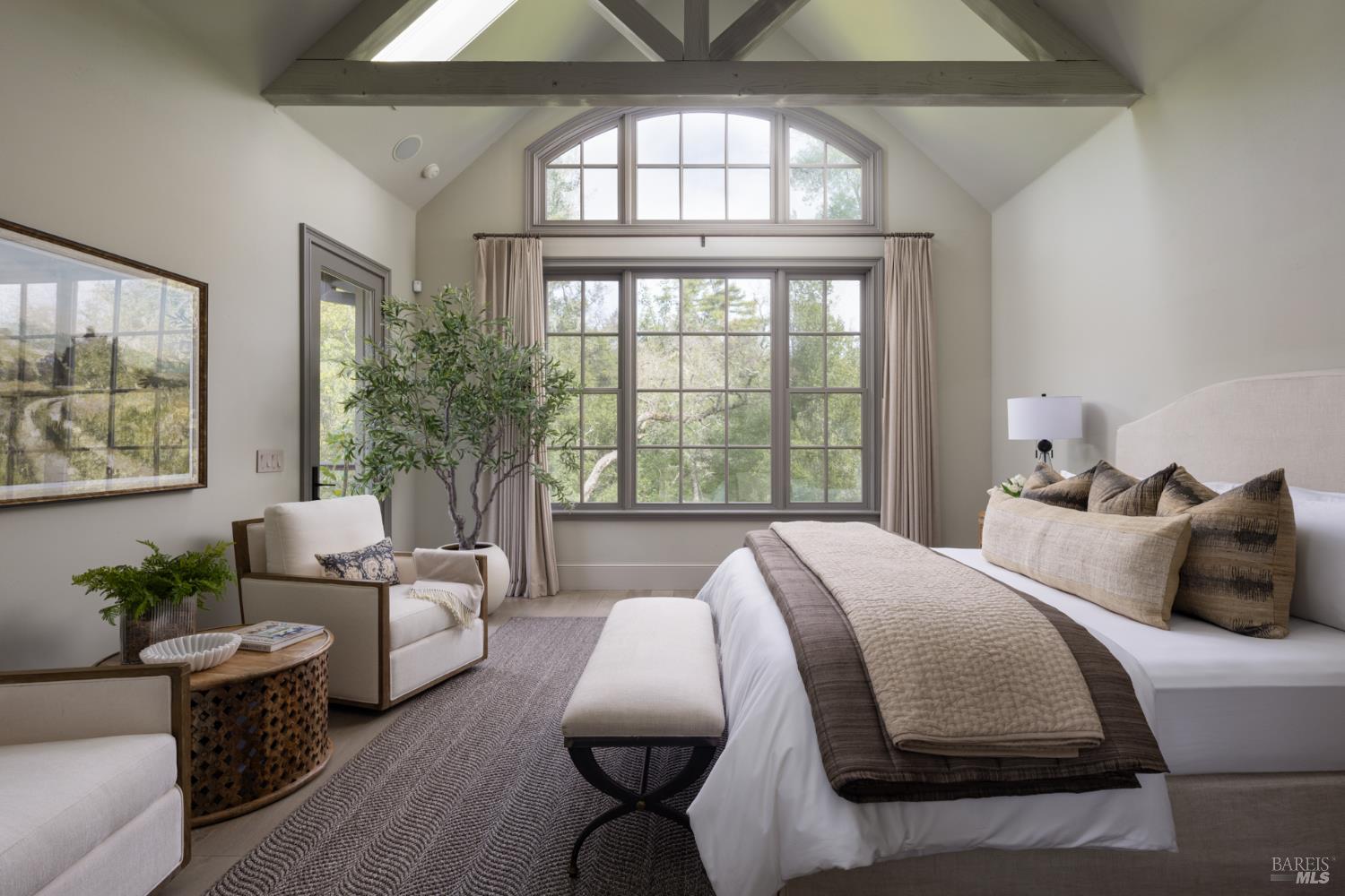 4504 Redwood Road Napa, CA 94558 - Photo 24 of 57 a bedroom with a large bed and windows