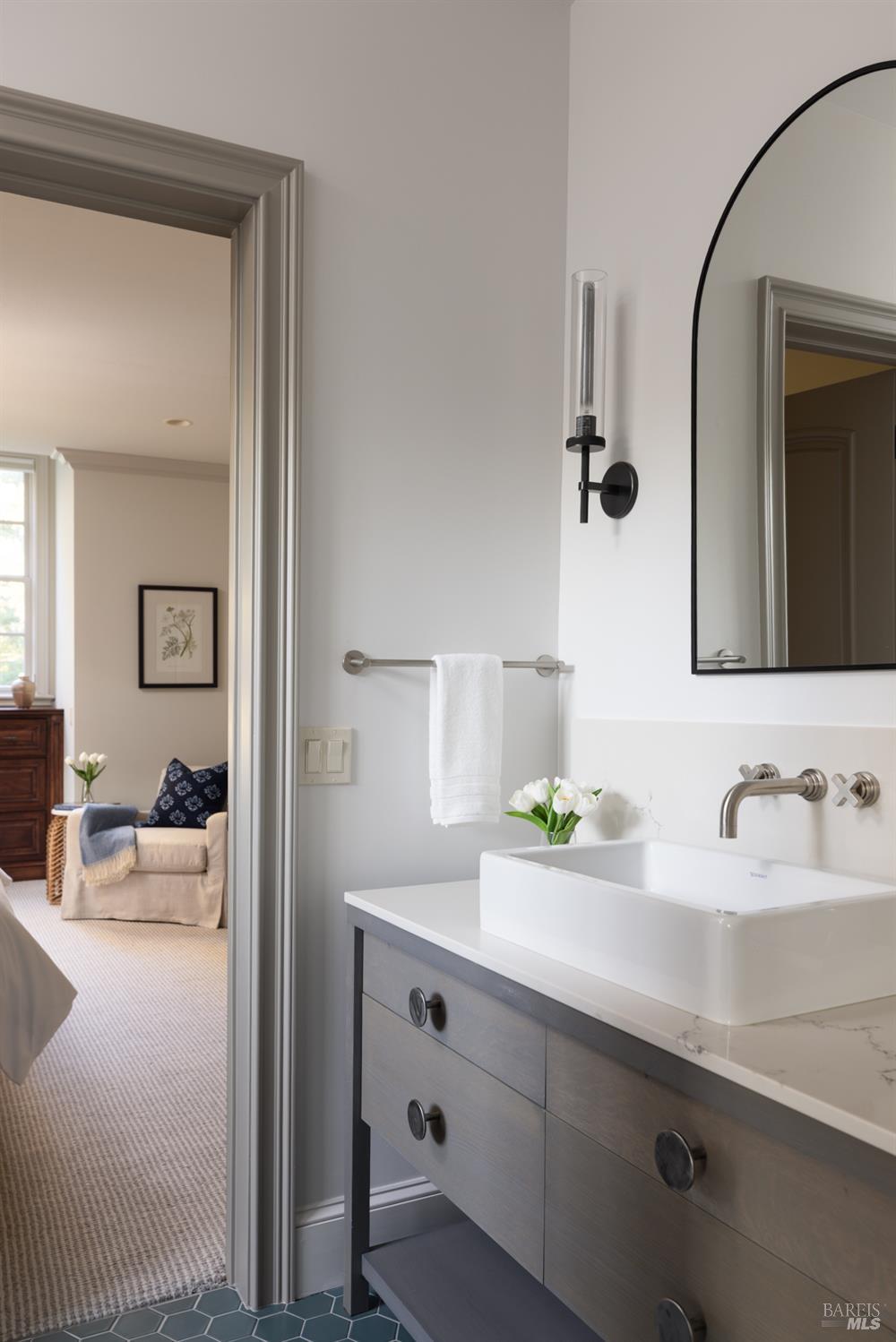 4504 Redwood Road Napa, CA 94558 - Photo 36 of 57 a bathroom with a double vanity sink and a mirror