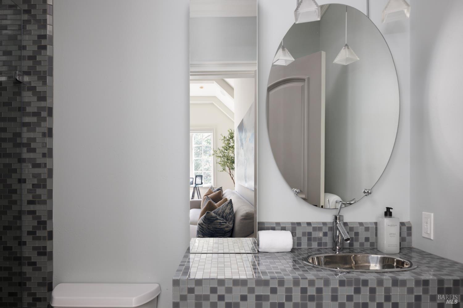 4504 Redwood Road Napa, CA 94558 - Photo 41 of 57 a bathroom with a toilet mirror and vanity