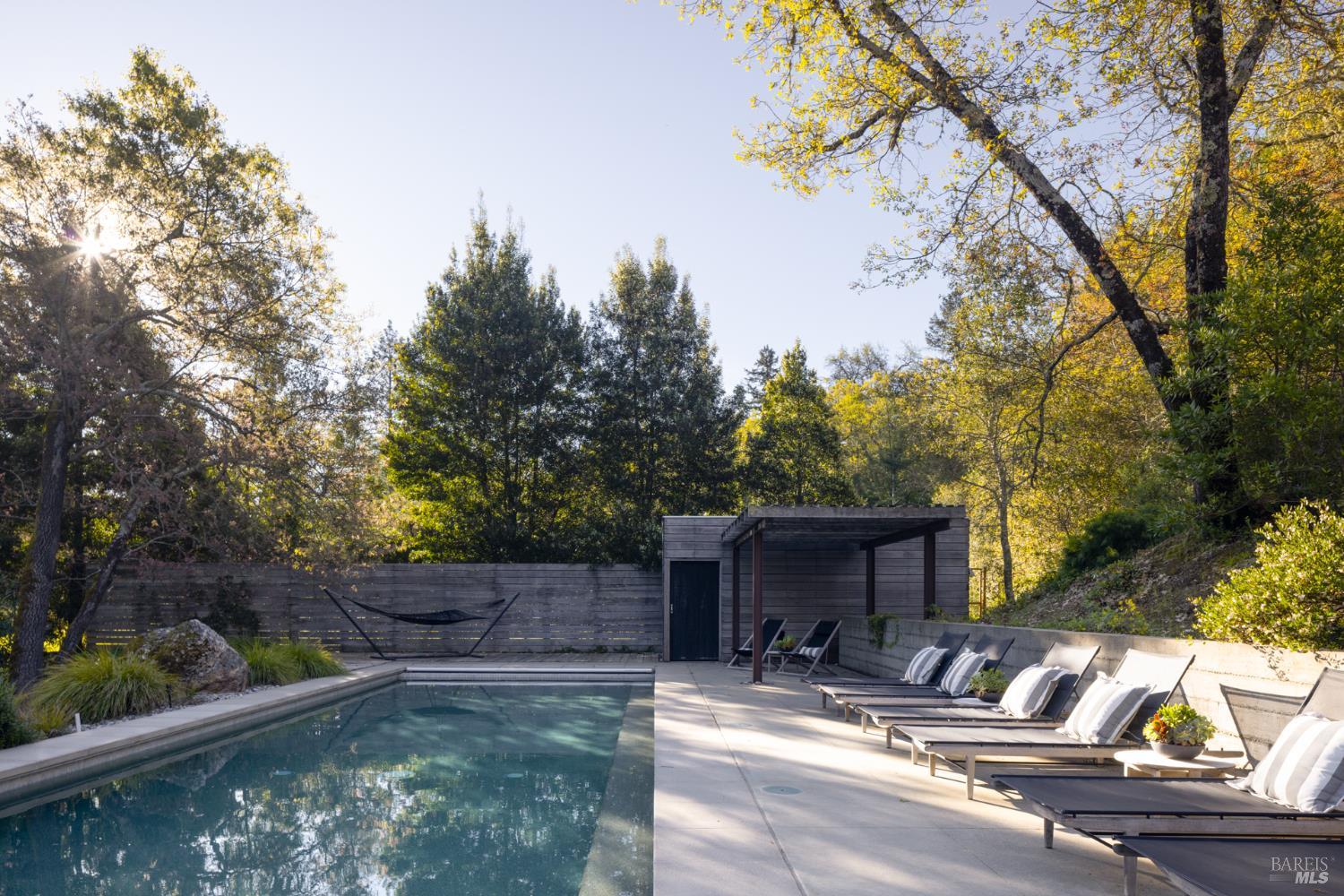 4504 Redwood Road Napa, CA 94558 - Photo 57 of 57 a view of backyard with a table and chairs under an umbrella