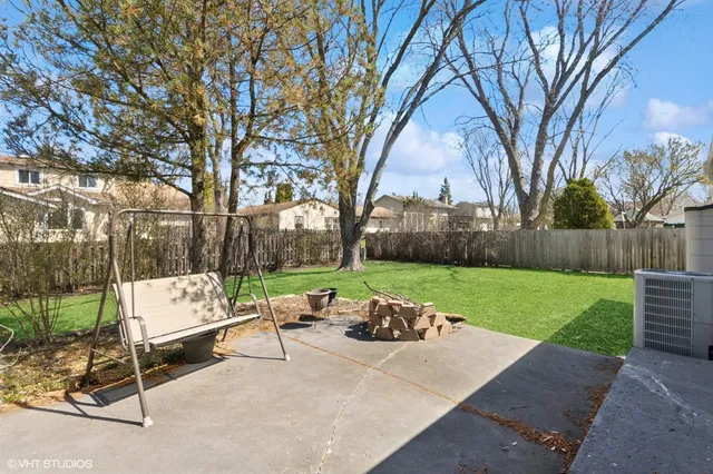a view of outdoor space with garden and trees