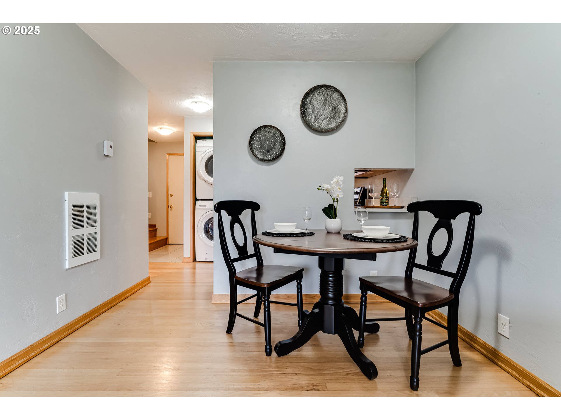 1555 Fetters Loop Eugene, OR 97402 - Photo 12 of 25 a dining room with furniture and a clock