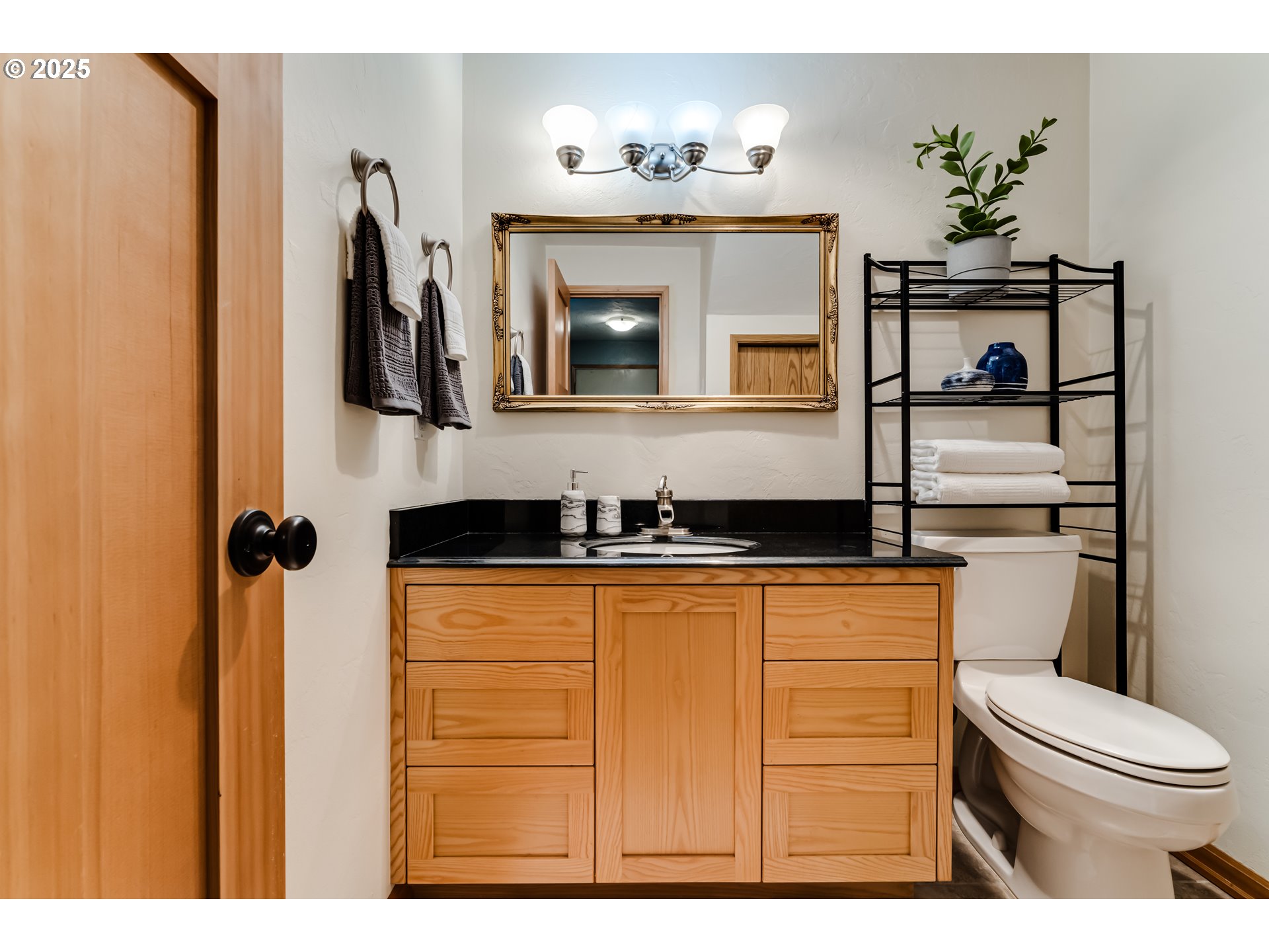 1555 Fetters Loop Eugene, OR 97402 - Photo 14 of 25 a bathroom with a sink and a mirror